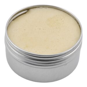Open one ounce Thrive Botanical Balm tin showing the neutral balm texture