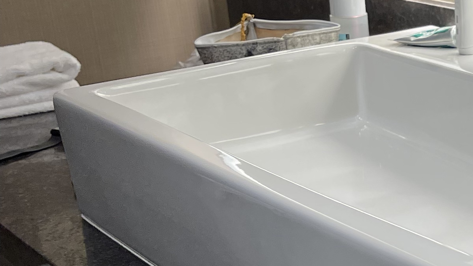 Clean bathroom sink with folded towels for a simple handmade soap routine
