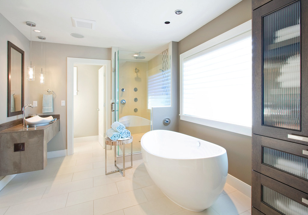 Bright guest bathroom with folded towels for a simple summer hosting routine