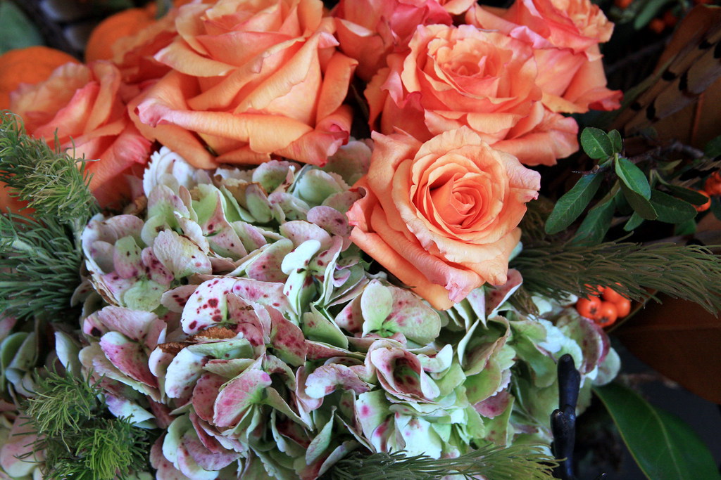 Peach roses and soft greenery for a thoughtful clean beauty wedding welcome bag guide