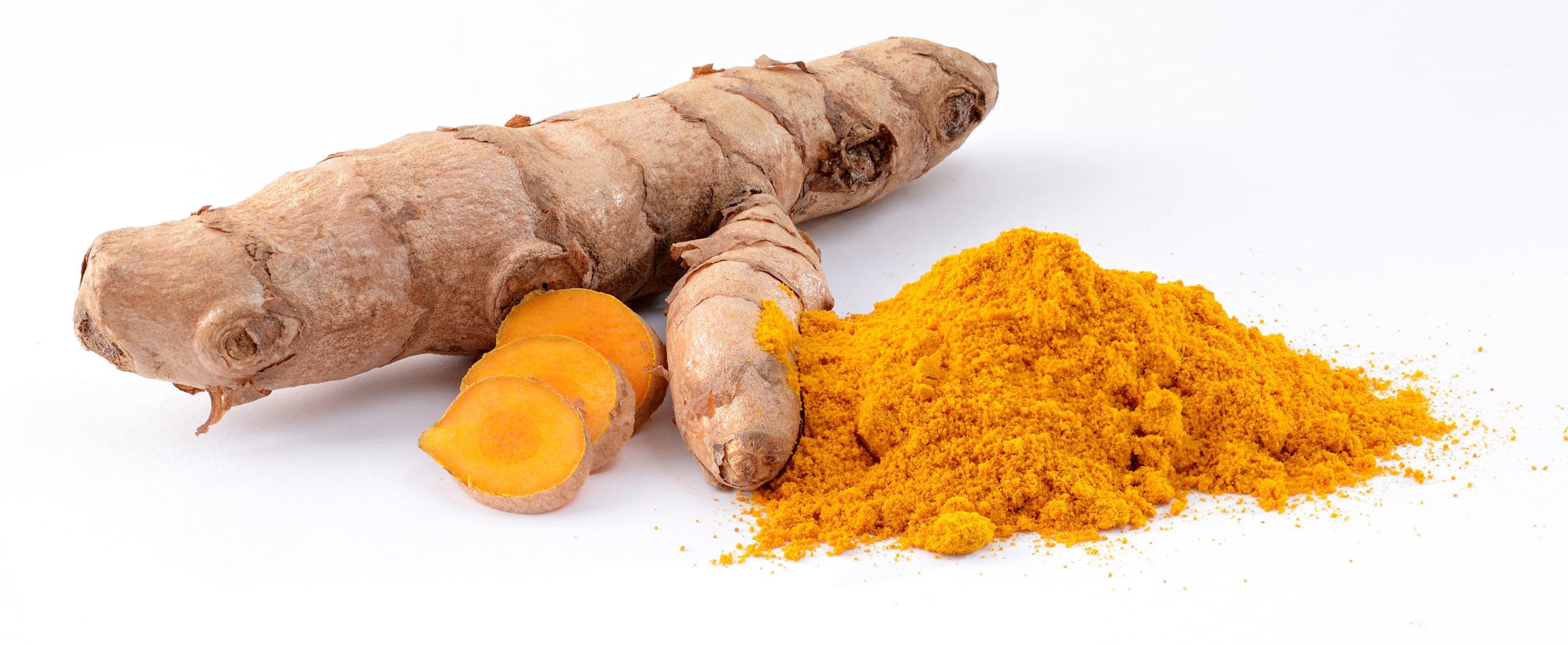 Fresh turmeric roots and golden turmeric powder on a clean white background