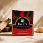 Plumera Sandalwood handmade soap with black and rust marbling in kraft packaging