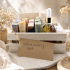 Nature Loving Gift Set in a light wood box with four handmade soaps, dropper oil, balm containers, wooden dish, and fiber accessories